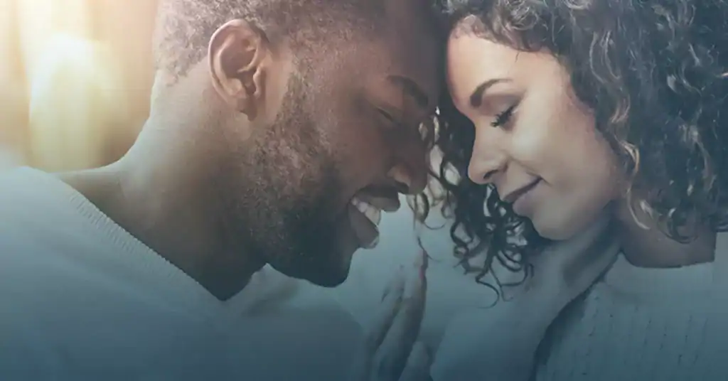 Intimate moment between couple with foreheads touching